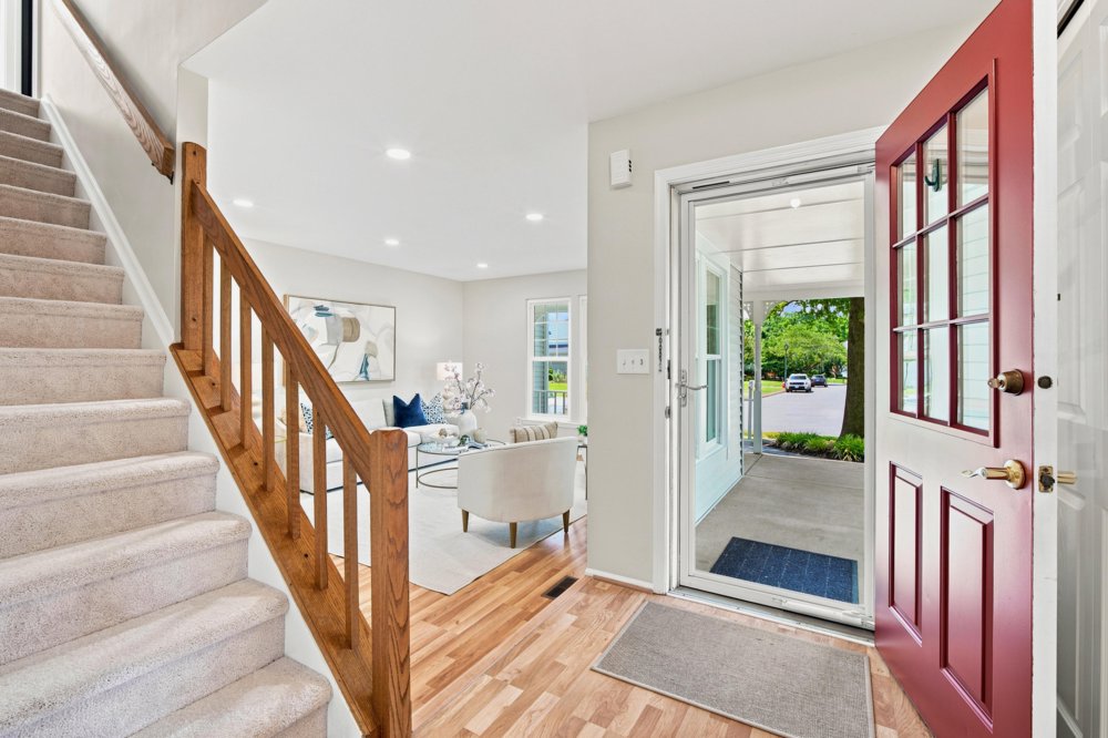 Entry with staircase and red front door