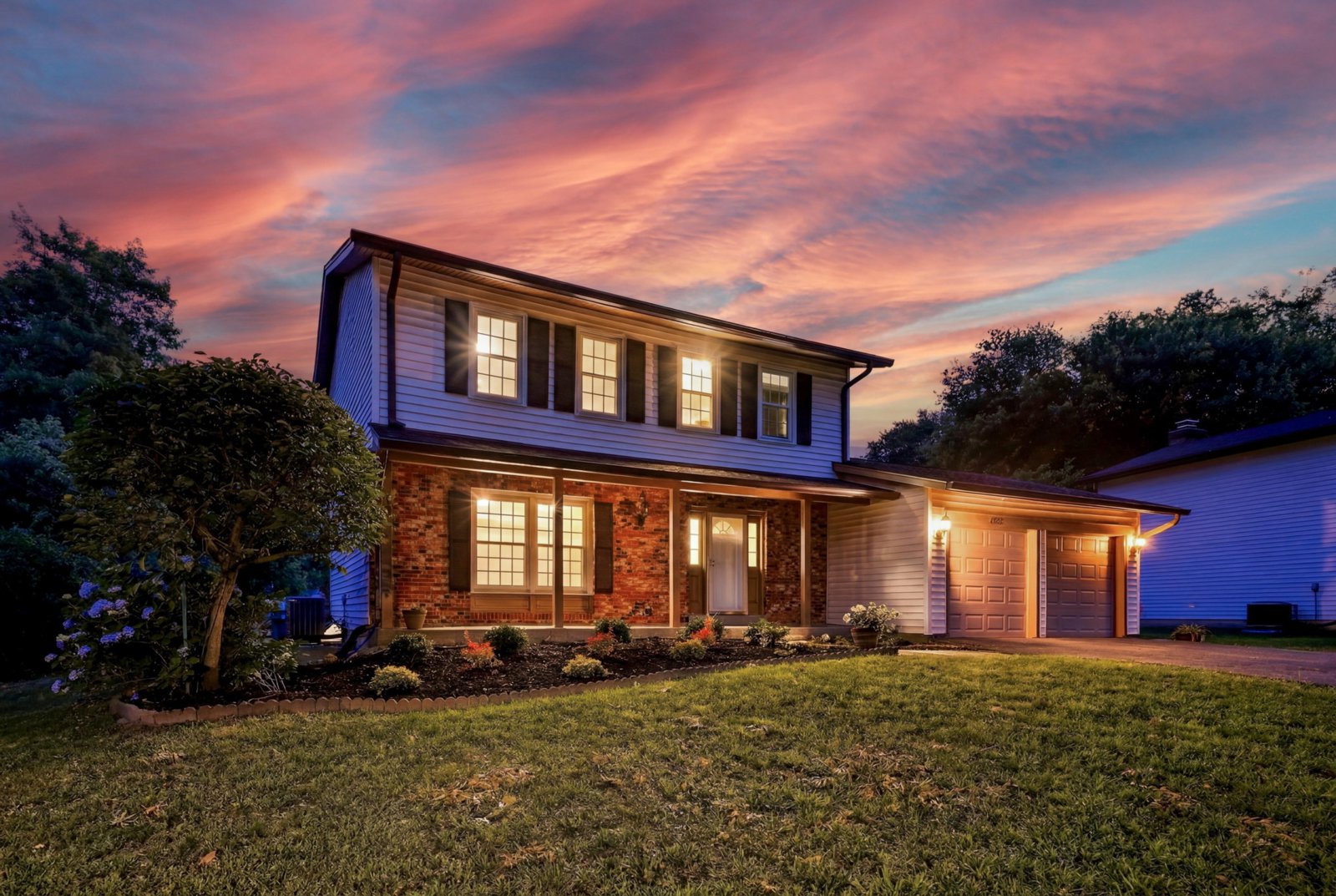 Twilight front elevation under a pink sky