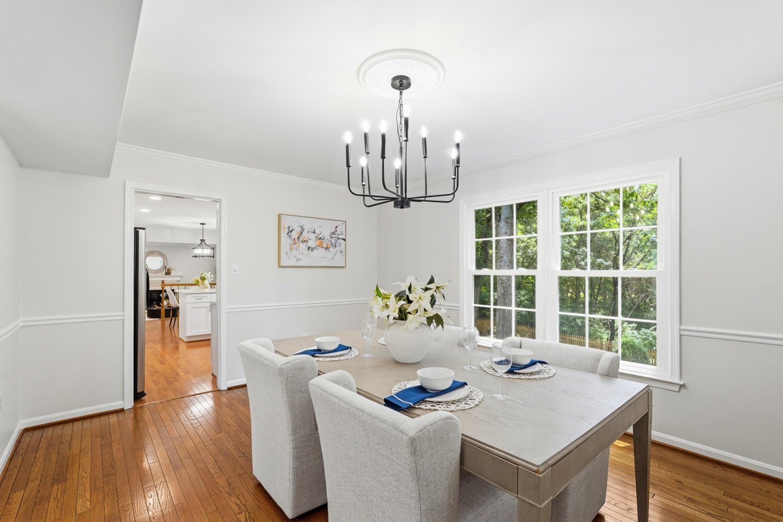 Dining room under a chandelier