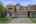 Blurred preview of media: Suburban house with green lawn