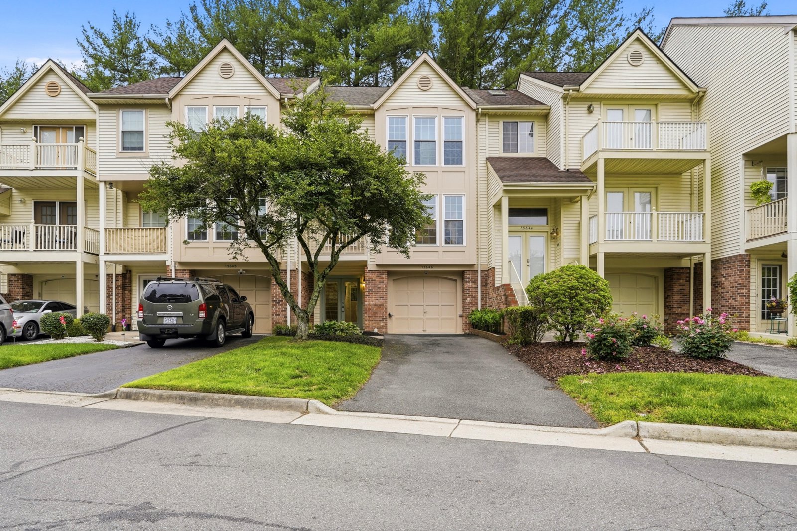 Row of townhomes on a tree lined street