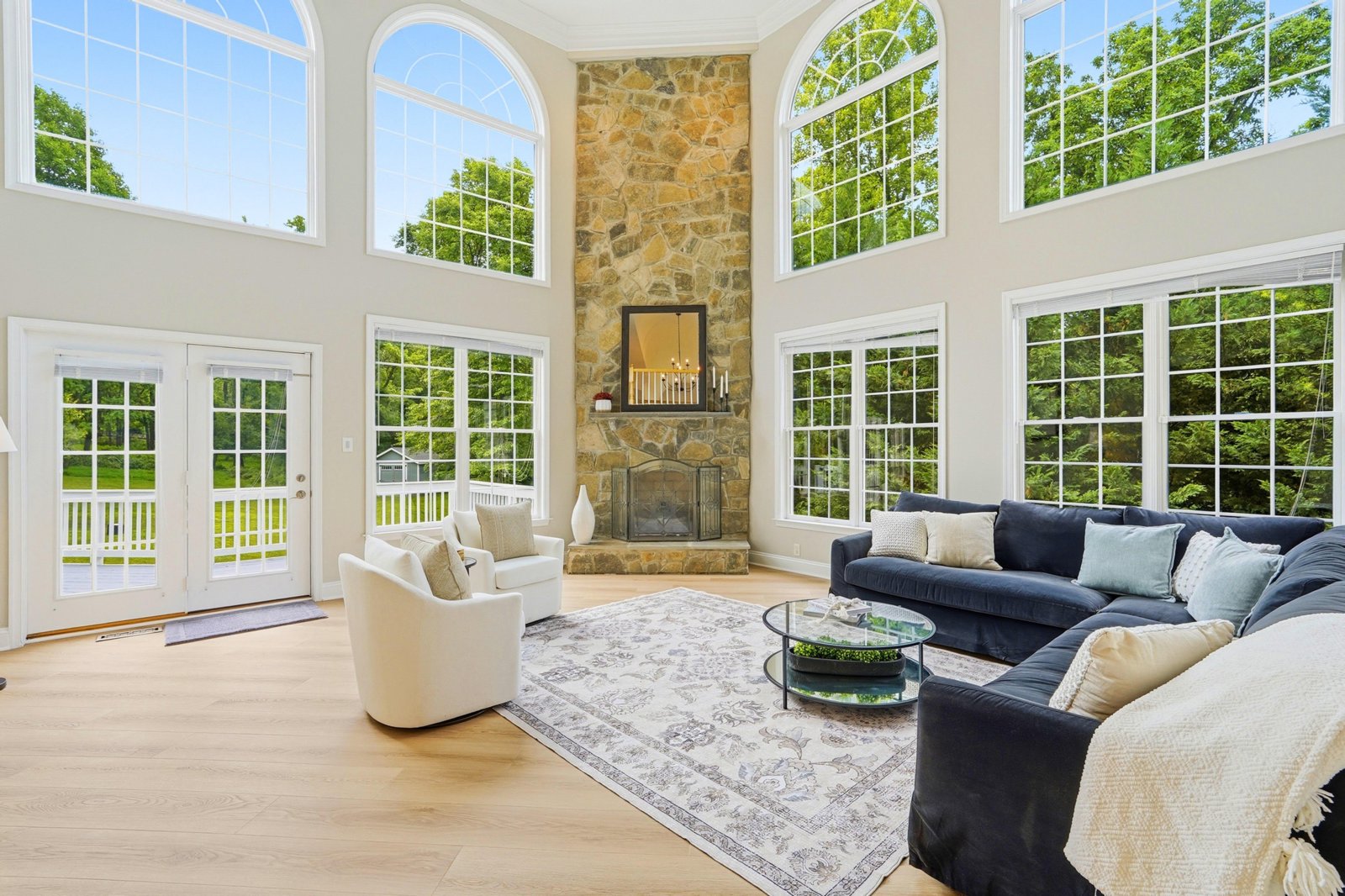 Two-story great room with stone fireplace