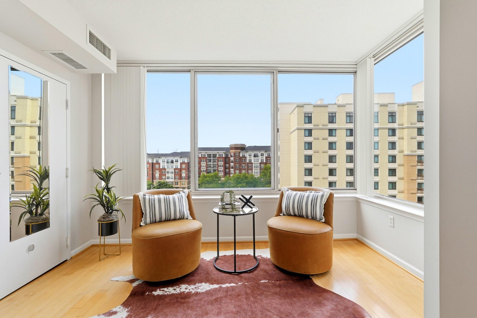Staged condo sitting area with a city view
